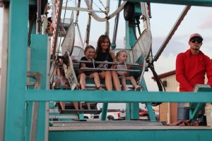 Mom and kids riding ferris wheel