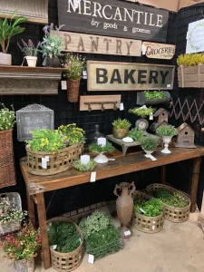 Trade Show booth with rustic signs and plants