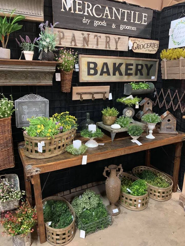 Trade Show booth with rustic signs and plants